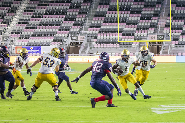 St. Thomas Aquinas quarterback Zion Turner (1) runs the ball during the Class 7A State Championship game between Aquinas and Tampa Bay Tech at DRV PNK Stadium in Fort Lauderdale, Dec. 17, 2021. Aquinas won the championship with a final score of 42-14.