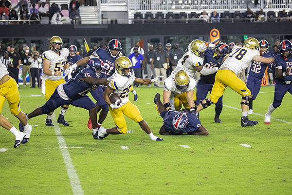 St. Thomas Aquinas running back Xavier Terrell (25) runs the ball during the Class 7A State Championship game between Aquinas and Tampa Bay Tech at DRV PNK Stadium in Fort Lauderdale, Dec. 17, 2021. Aquinas won the championship with a final score of 42-14.