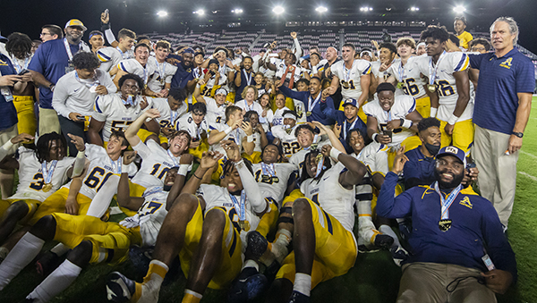 The St. Thomas Aquinas Raiders celebrate after winning the Class 7A State Championship game against the Tampa Bay Tech Titans at DRV PNK Stadium in Fort Lauderdale, Dec. 17, 2021. Aquinas won the championship with a final score of 42-14.