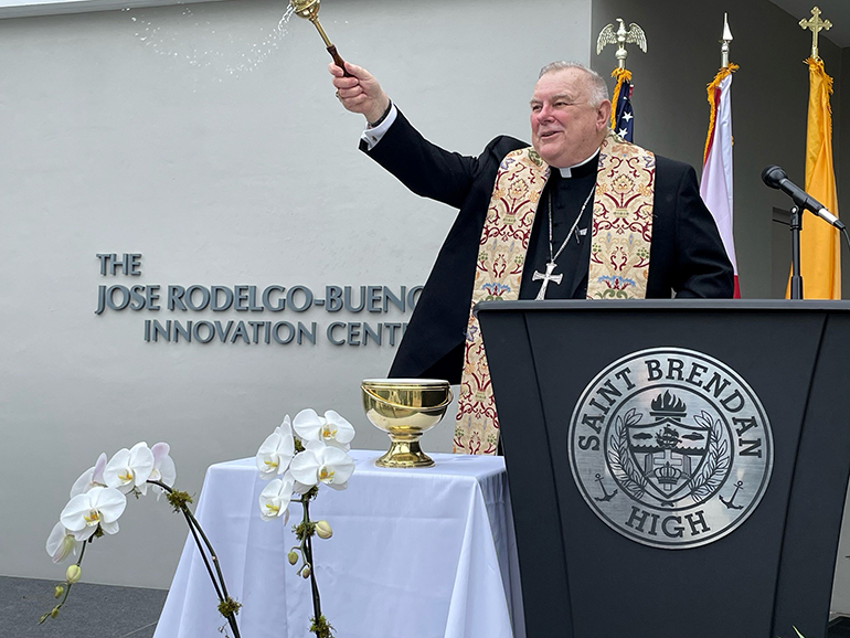 Archbishop Thomas Wenski blesses the renamed Jose Rodelgo-Bueno Innovation Center at St. Brendan High School, Jan. 12, 2022. Rodelgo-Bueno, who served as principal from 2012 to 2020, was pivotal to the construction of the state-of-the-art building.