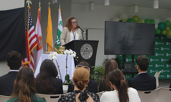 St. Brendan's interim principal, Ivette Alvarez, addresses students and staff during the renaming of St. Brendan High School's  Innovation Center in honor of Jose Rodelgo-Bueno, who served as principal from 2012 to 2020 and was pivotal to the construction of the state-of-the-art building. The rededication took place Jan. 12, 2022.