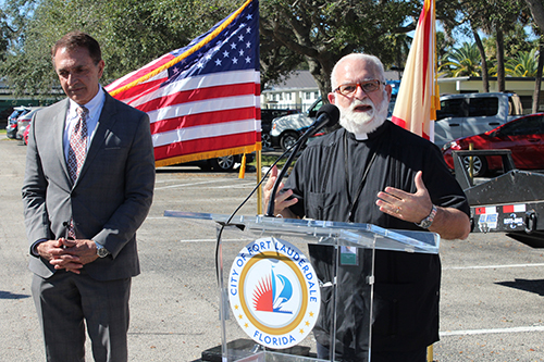 Father Joseph Maalouf, administrator of St. Jerome Church, invokes a prayer during the groundbreaking for a stormwater project for the neighborhoods of Edgewood and River Oaks, both a part of the City of Fort Lauderdale, on Jan. 14, 2022. Next to Father Maalouf is Fort Lauderdale Mayor Dean Trantalis.