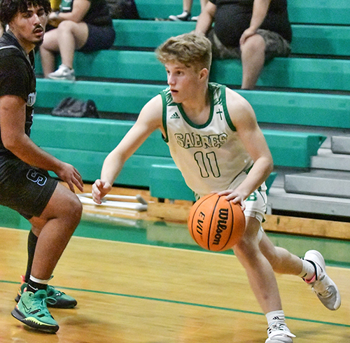 Alex Kettle, captain of St. Brendan High School's boys varsity basketball team, is showing here playing against Somerset.