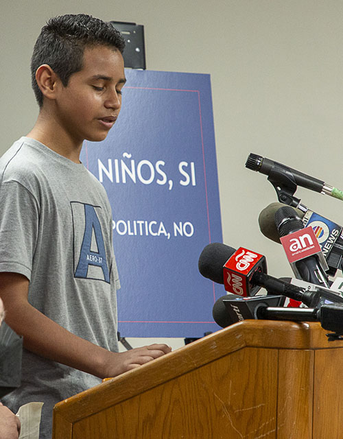Andy, an unaccompanied minor from Honduras who spent 11 days at Catholic Charities' Msgr. Bryan O. Walsh Children's Village, speaks to the media about his experience, Feb. 10, 2022.
