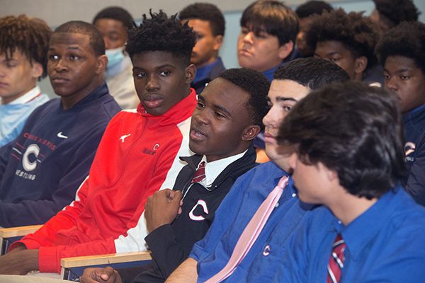 Marquis Peoples, 17, a senior at Christopher Columbus High School, asks Alexander Martin, Dolphins assistant for player development, to define the difference between quitting and moving on during the Black History and Leadership Lecture Panel held Feb. 23, 2022. The panel marked Black History Month at the Marist Brothers' all-boys school.