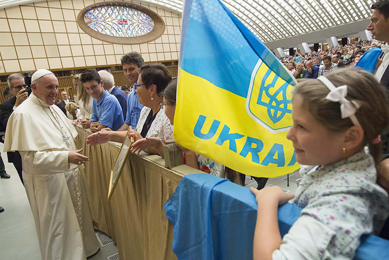 Pope Francis greets pilgrims from the Ukraine at the general audience in Paul VI Audience Hall on Aug. 19, 2015.