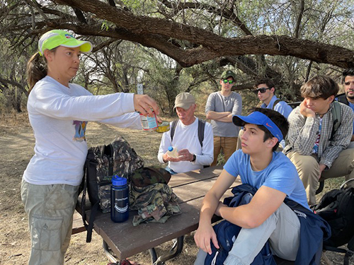 Belen students listen as Sister Tracey Horan, director of education and advocacy for the Kino Border Initiative, explains the conditions under which migrants cross the desert to seek asylum in the U.S.