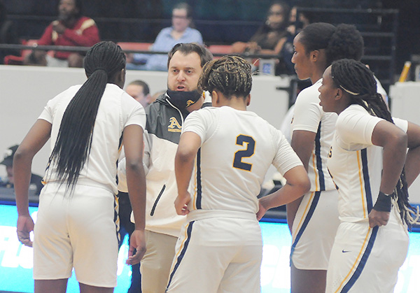Head coach Oliver Berens prepares his starters for tipoff before St. Thomas Aquinas' 59-45 victory over Apopka Wekiva in the FHSAA Class 6A girls basketball state-championship game, Feb. 26, 2022, at the RP Funding Center in Lakeland. The Raiders won their second consecutive state title.