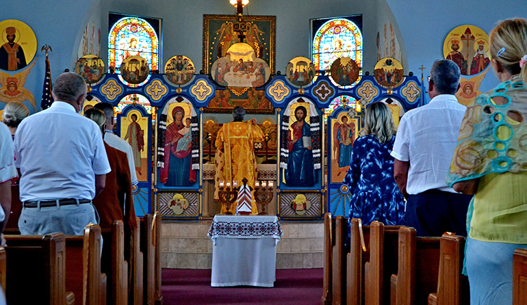 Nearly 200 people attend divine liturgy at Assumption of the Blessed Virgin Mary Church, a Ukrainian Catholic congregation in Miami, before the Feb. 27, 2022 protest against the Russian invasion of their homeland. Most of them stayed for the protest.