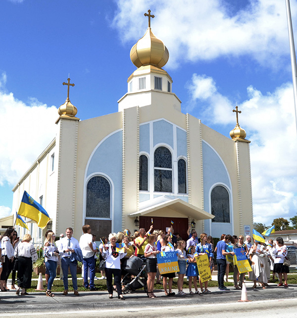 Members and friends of Assumption of the Blessed Virgin Mary Church, a Ukrainian Catholic congregation in Miami, demonstrate their support for their homeland on Sunday, Feb. 27, 2022.