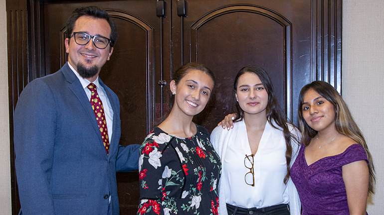 Posing for a photo after the Miami Archdiocesan Council of Catholic Women's annual scholarship luncheon, from left: Cardinal Gibbons Principal Oscar Cedeno, recognized this year for his contributions to the Catholic education; and scholarship recipients Isabella Parra and Alexis Battoo, both attending Gibbons, and Aolani Dominguez, who attends St. Thomas Aquinas High School. The annual scholarship luncheon, which resumed after a one-year hiatus due to the COVID-19 pandemic, raises funds that help girls graduating from Catholic elementary schools to continue their education at a Catholic high school. The luncheon took place Feb. 19, 2022 in Fort Lauderdale.