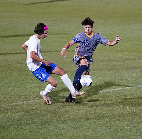 Belen Jesuit's Stefano Naos, who scored the winning goal, fights for the ball during the Wolverines' defense of last year's state championship, a 1-0 defeat of Panama City Beach's Arnold High, Feb. 26, 2022.