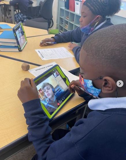 Patricio Chataigne, a student from St. Mary Cathedral School in Miami, interviews a student from St. Louis Covenant School in Pinecrest via Google Meet on their tablets. Fifth graders and their classmates at both schools teamed up to read "Wonder" by R.J. Palacio.