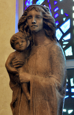 Statue portrays a heroic-looking Mary with wind-blown hair ...