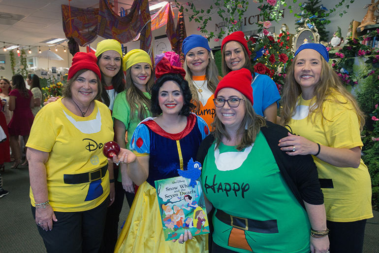 The "Snow White and the Seven Dwarfs" group pose for a photo at the Literary Affair luncheon at St. Louis Covenant School, March 12, 2022.