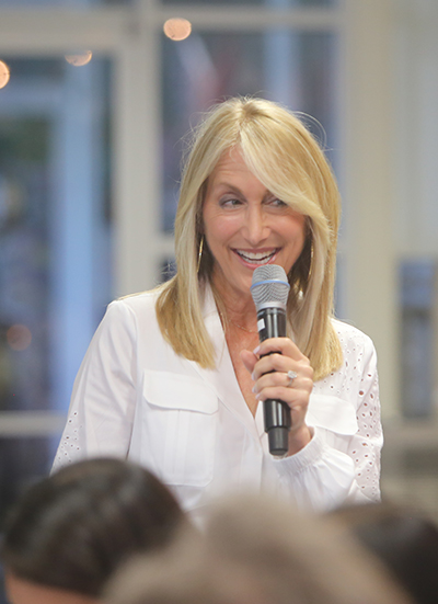 Laurie Friedman, children's book author, addresses participants at the Literary Affair luncheon at St. Louis Covenant School, March 12, 2022.