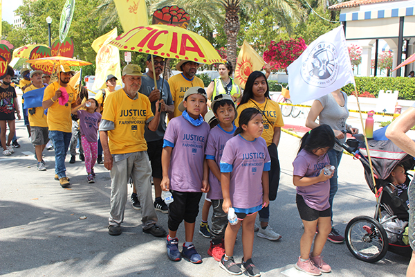 Farmworkers with the Coalition of Immokalee Workers are joined by supporters April 2, 2022 in the streets of Palm Beach and West Palm Beach as they march to bring awareness to many issues faced by laborers in the fields.