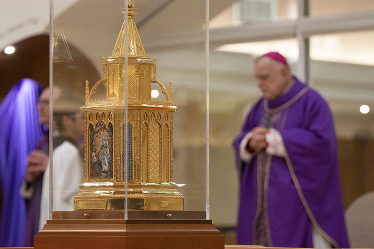 Archbishop Thomas Wenski prays during the Mass of welcome for the relics (front) of St. Bernadette at Our Lady of Lourdes in Miami, April 11, 2022.


Nearly 2,000 faithful gathered at Our Lady of Lourdes Church for a Mass and procession with the relics as they embark on their first tour of the U.S. Our Lady of Lourdes and St. Bernadette in Hollywood, both in the Archdiocese of Miami, were the relics' first stop. Their tour will continue through August, stopping mostly at churches throughout the U.S. named after Our Lady of Lourdes and St. Bernadette.