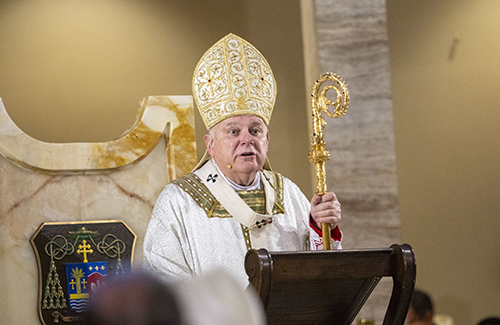 Archbishop Thomas Wenski preaches his homily from the "cathedra" or bishop's chair from which the word "cathedral" is derived. The chrism Mass was celebrated April 12, 2022 at St. Mary Cathedral.