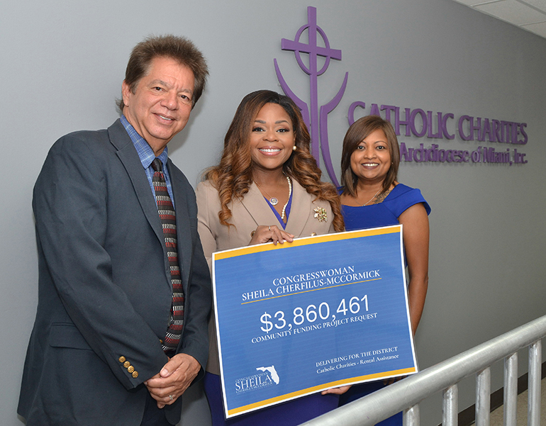 Congresswoman Sheila Cherfilus McCormick, center, joins Catholic Charities officials in celebrating the acceptance of a $ 3.8 million grant application for rent assistance for Broward County residents. With her are Peter Routsis-Arroyo, CEO, and Devika Austin, chief administrative officer.