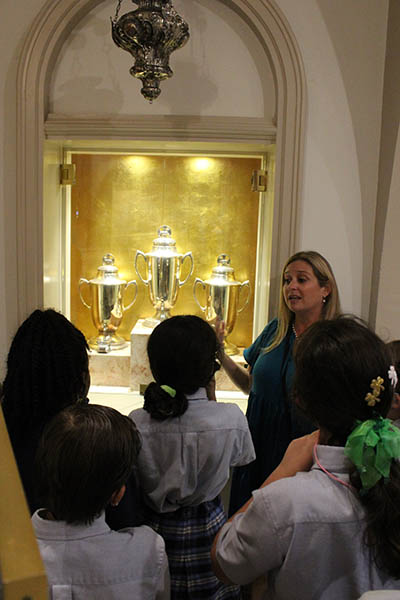 St. Mary Cathedral School Principal Julie Perdomo shows fifth graders from St. Louis Covenant School and St. Mary Cathedral School the chrism oils housed in the cathedral. Students from both schools gathered on March 17, 2022 for "We Are All God's Wonder Day" at St. Mary's.