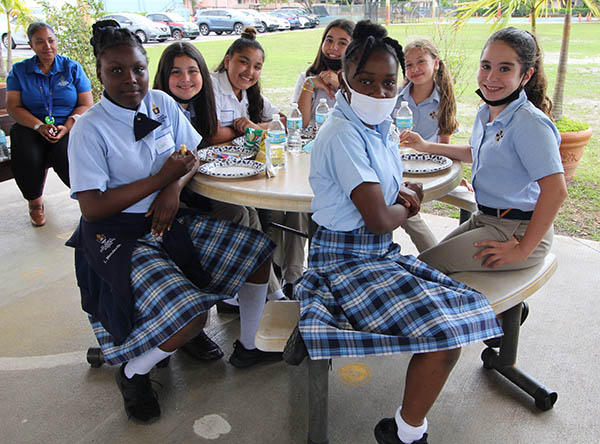 Fifth graders from St. Mary Cathedral School and St. Louis Covenant School share a meal together after a day of fellowship. Students from both schools gathered on March 17, 2022 for "We Are All God's Wonder Day" at St. Mary's. After reading "Wonder" by R.J. Palacio together, but from a distance, students from both schools spent the day doing activities revolving around the novel and getting to know each other better.