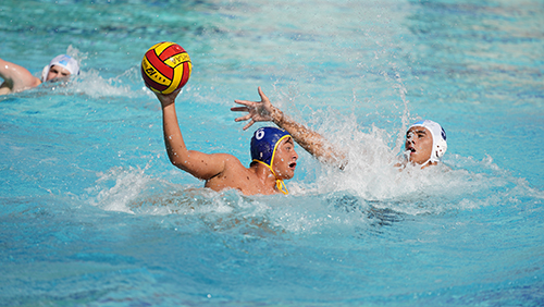 Senior Carlos Veccio (6) takes aim during Belen Jesuit Prep's championship water polo match April 23, 2022 in Miami. The Wolverines defeated Orlando's Dr. Phillips High School 17-13 to win the FHSAA state championship and complete an undefeated season.