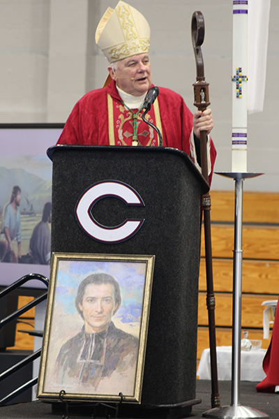 Archbishop Thomas Wenski preaches his homily with students, teachers, staff and guests during a Mass he celebrated at Christopher Columbus High School in Miami on April 28, 2022. After the Mass, he blessed the new Marcus Lemonis and Mario Sueiras Center for Science and the Arts building.