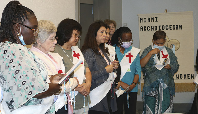 Participants at the 62nd annual Miami Archdiocesan Council of Catholic Women's convention take part in a Living Rosary, one of the spiritual events that highlighted the weekend gathering, April 29-May 1, 2022 in Deerfield Beach.
