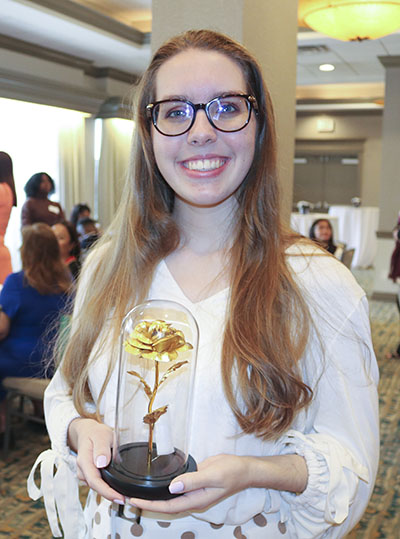 The Miami Archdiocesan Council of Catholic Women's Golden Rose Award recipient, Grace Chaffins, is all smiles after receiving the council's first award, presented April 30, 2022. She is active at Our Lady of Lourdes Parish in Miami, is homeschooled and will graduate in June.