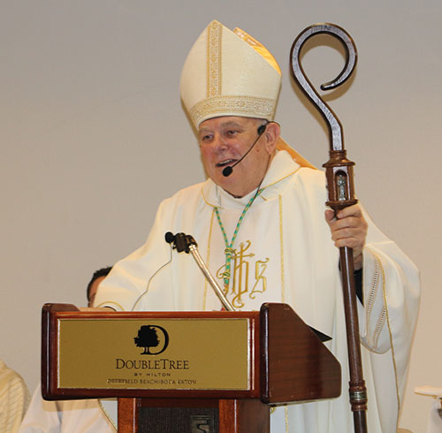 Archbishop Thomas Wenski celebrates Mass on the second day of the Miami Archdiocesan Council of Catholic Women's 62nd annual convention, held April 29-May 1, 2022, in Deerfield Beach. At left is Father Michael Greer, spiritual advisor to the MACCW.