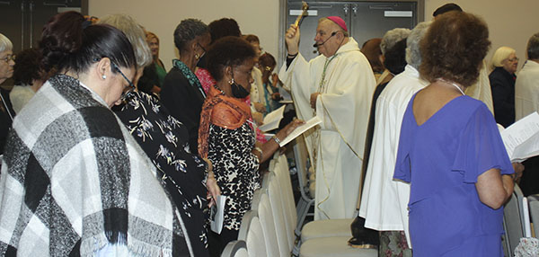 LINDA REEVES| FCOn the second day of the Miami Archdiocesan Council of Catholic Women's convention, Archbishop Thomas Wenski begins Mass by blessing with holy water the ladies attending the event, held in Deerfield Beach April 29-May 1, 2022.