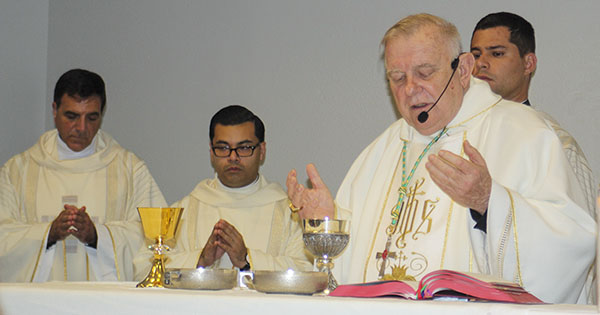 Archbishop Thomas Wenski is the main celebrant during Mass on the second day of the Miami Archdiocesan Council of Catholic Women's convention, held April 29-May 1, 2022. Concelebrating with him are Msgr. Michael Souckar and Father Yamil Miranda. Also shown is Deacon Enzo Rosario Prendes, who would be ordained a priest a week later.