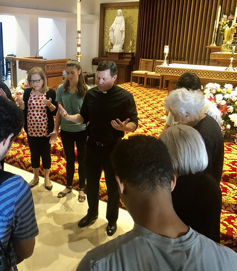 Father Richard Vigoa, pastor, prays with a group of around 65 parishioners during the National Day of Prayer, May 5, 2022.