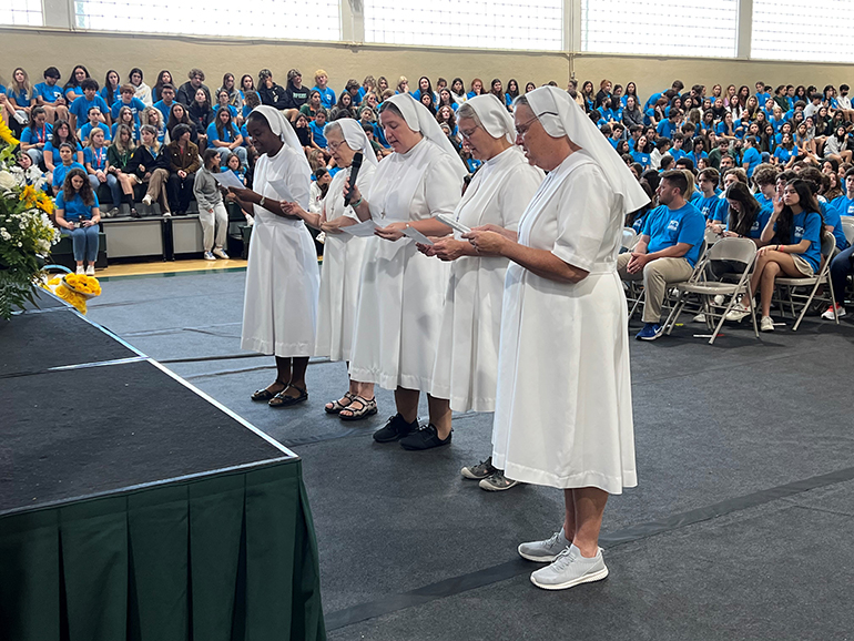 On the 150th anniversary of the foundation of the Salesians, May 5, 2022, the Salesian Sisters who work at Immaculata-La Salle High School in Miami renewed their vows in front of assembled students and staff. From left: Sister Myriam Meus, Sister Mary Rinaldi, who was visiting, Sister Katie Flanagan, Sister Eileen Tickner and Sister Kim Keraitis, principal.