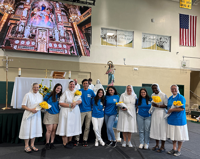 The Salesian Sisters who work at Immaculata-La Salle High School in Miami pose with some students after renewing their vows. From left:  Sister Mary Rinaldi, who was visiting, Sister Katie Flanagan,  Sister Kim Keraitis, principal, Sister Myriam Meus, and Sister Eileen Tickner.