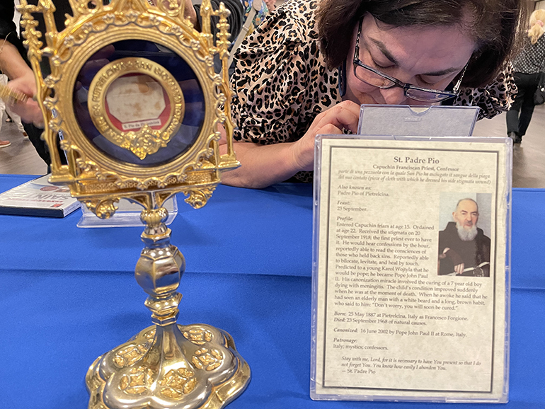 A visitor venerates a relic May 18, 2022, at Our Lady of Guadalupe Church in Doral. It was of the 150 relics currently touring parishes in the Archdiocese of Miami.