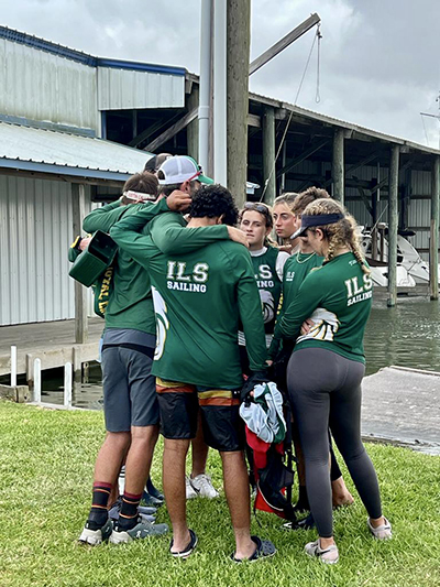 Immaculata-La Salle's sailing team say a prayer before competing in Houston, Texas, the weekend of May 21-22, 2022, for the Baker Team Racing National Championship.