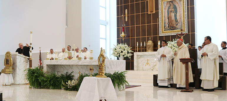 Archbishop Thomas Wenski greets Cardinal Baltazar Porras of Caracas at the start of the Mass celebrated by the cardinal for the Venezuelan community gathered at Our Lady of Guadalupe Church in Doral, May 1, 2022.