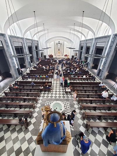 Our Lady of Belen looks from the rear to the front of Belen Jesuit Prep's new 600+ seat chapel, dedicated May 1, 2022.
