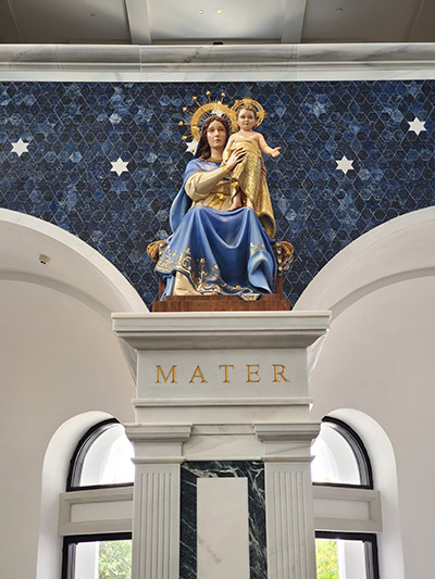 Our Lady of Belen looks from the rear to the front of Belen Jesuit Prep's new 600+ seat chapel, dedicated May 1, 2022.