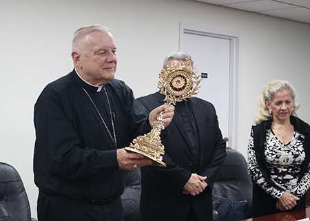 Archbishop Thomas Wenski holds a relic of Blessed José Gregorio Hernández during the ceremony where the documents of an investigation regarding an alleged miracle attributed to him were sealed and handed over to be sent to Rome, June 17, 2022.
