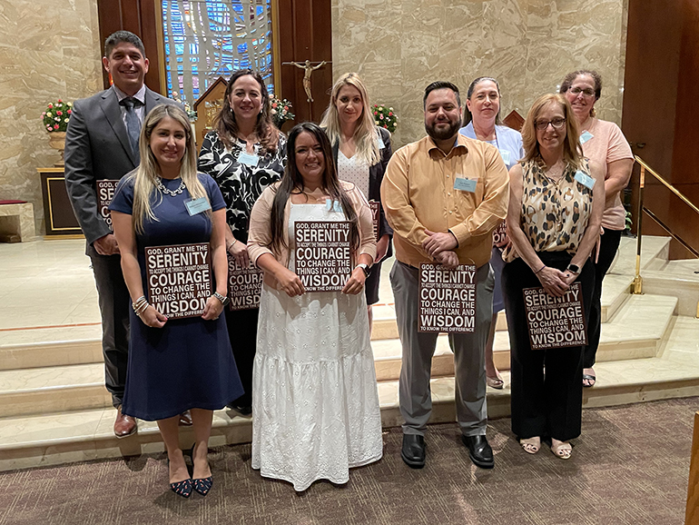 New principals pose for a photo after receiving their blessing and welcome gift: Top row, from left: Jorge Fleitas, St. Agnes; Maria Jebian, Annunciation; Stephanie Paguaga, St. Lawrence; Lisette Reina-Naranjo, St. Michael the Archangel; Heidi Suero, Nativity. Front row, from left: Melissa Hernandez, Good Shepherd; Jenna McIntosh, St. Anthony; Eric Palacio, Mary Help of Christians; and Lisa Young, St. Gregory.