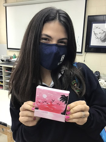 Senior Maya Netto shows her canvas as the art students at St. Brendan High prepare for a delivery to the Christine E. Lynn Rehabilitation Center at Jackson Medical Center's main campus. The students have created and delivered over 200 canvases since spring 2021.