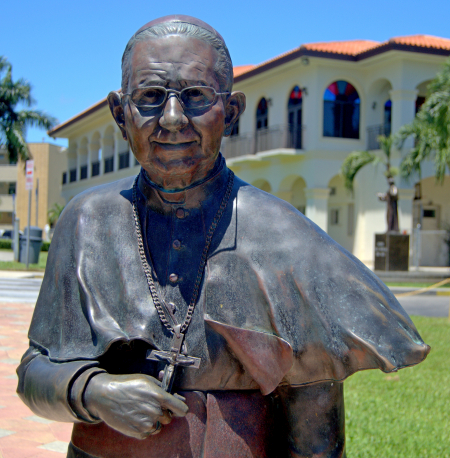 Bishop Agustin Roman, himself a Cuban refugee, is honored in a life-size statue at La Ermita. He spearheaded the campaign to build the shrine, then served there until his death in 2012.
