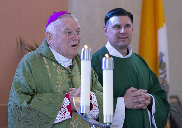 Archbishop Thomas Wenski celebrates Mass at the start of the Archdiocesan principals' meeting with staff from the Office of Catholic Schools to prepare for the start of the 2022-23 school year, which took place Aug. 2, 2022 at St. Thomas University in Miami Gardens. Next to him is Father Rafael Capo, vice president for Mission at St. Thomas University.