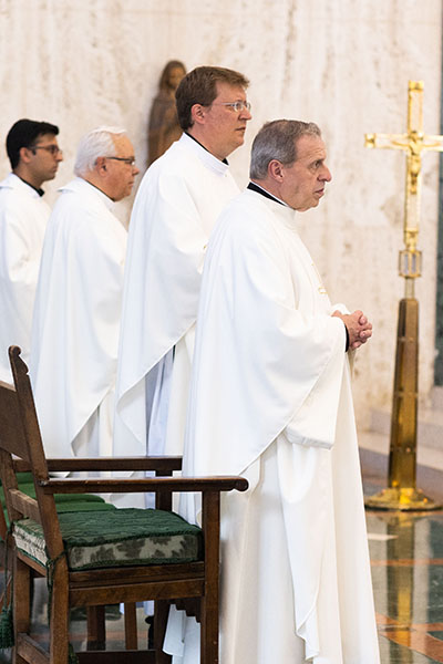 On the feast day of St. John Vianney, Aug. 4, 2022, Miami Archbishop Thomas Wenski celebrated Mass at St. John Vianney College Seminary in Miami as part of an annual tradition to meet with seminarians and visit the seminary with a dinner reception following Mass. On hand were the seminary rector-president, Msgr. Pablo Navarro, front, along with Father Matthew Gomez, director of vocations for the Miami Archdiocese, and Father Emanuele De Nigris, second from left, rector of nearby Redemptoris Mater in Hialeah.