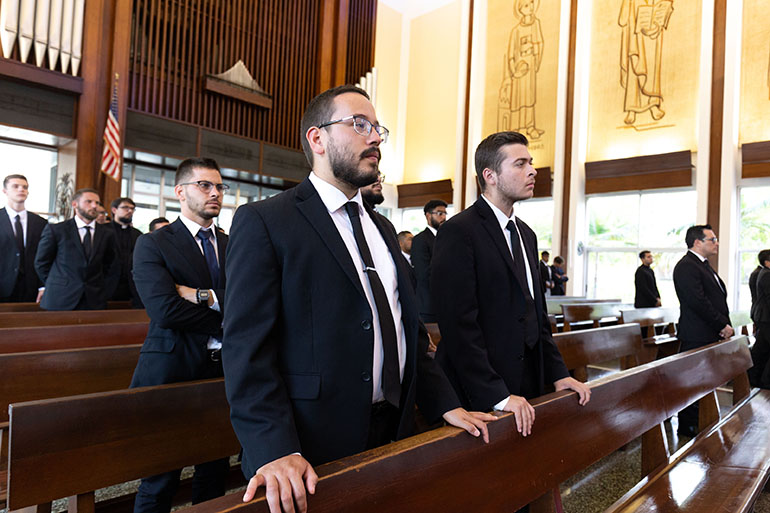 Seminarians take part in the Mass on the feast day of St. John Vianney, Aug. 4, 2022, celebrated by Miami Archbishop Thomas Wenski at St. John Vianney College Seminary in Miami. The Mass concluded the annual convocation of archdiocesan seminarians before the start of their academic year.