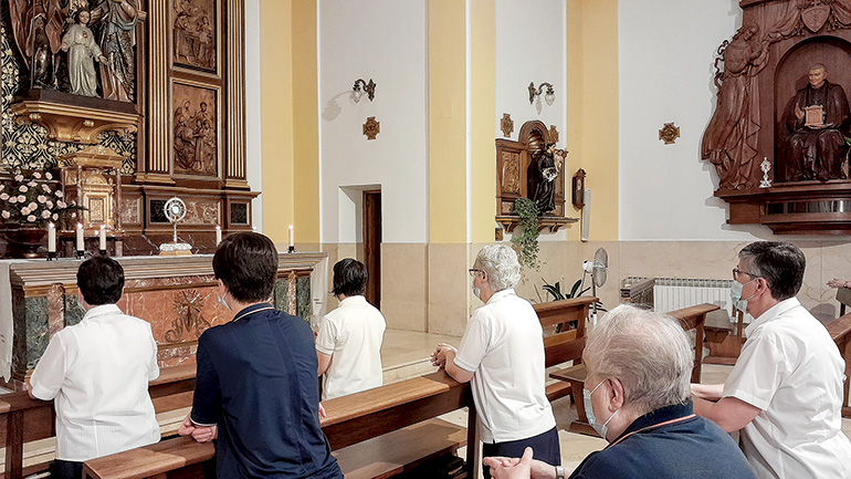Faithful adore the Blessed Sacrament in the chapel of the Eucharistic Missionaries of Nazareth in Madrid, Spain.