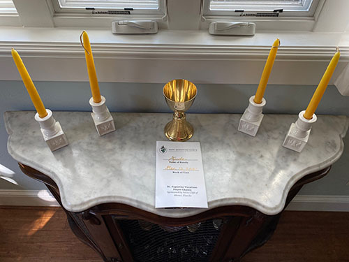 The Vocations Prayer Chalice Program, pictured here, involves parish families â€” a different one each week â€” taking home a chalice at Sunday Mass, receiving a blessing from the priest, and then praying for vocations every day of that week as a family. Serra Club Miami is hoping every parish will participate.
